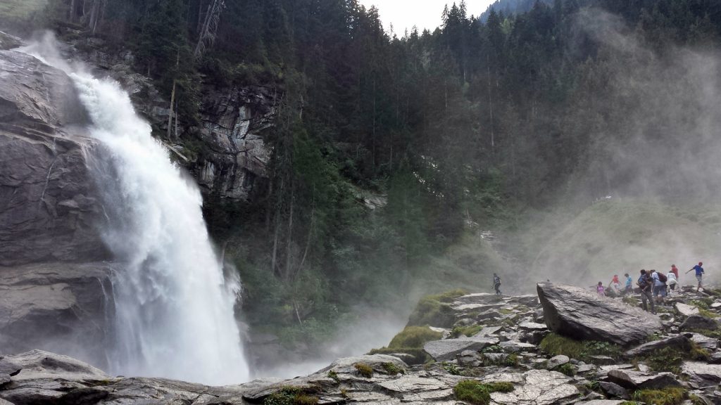 With a big cloud of spray Kimml Waterfall plunges into the depth