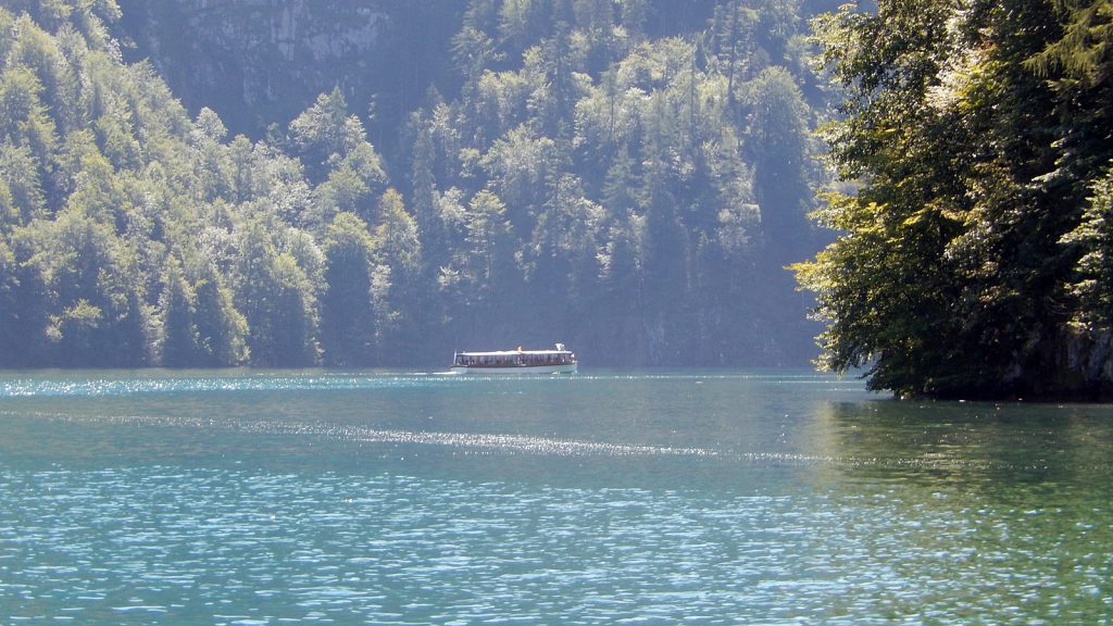 Silently the boats slide across Lake Königssee